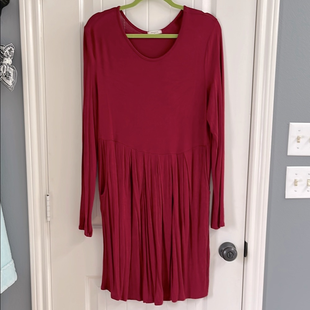 Red/Burgundy Long Sleeve Pleated Dress with pockets.